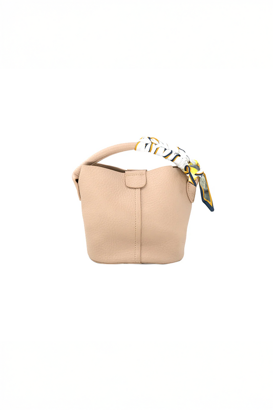 Beige handbag with a decorative strap on a white background