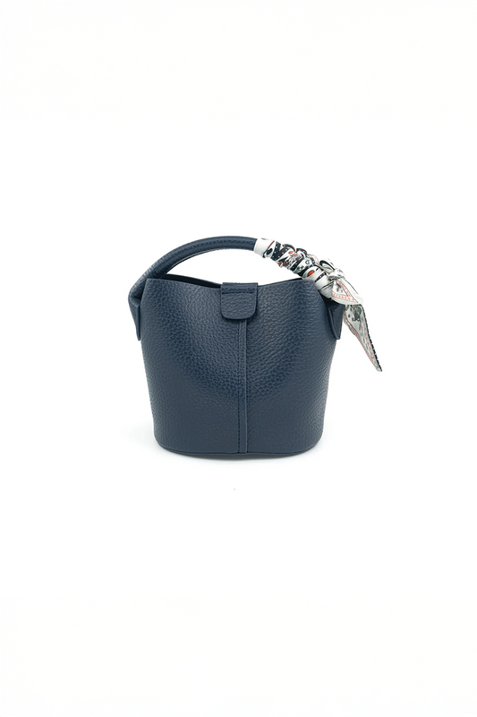 Navy handbag with decorative handle on a white background