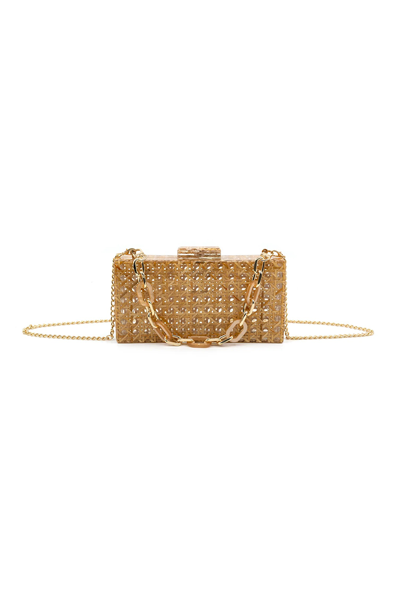 Acrylic straw woven clutch bag with gold chain handle on a white background