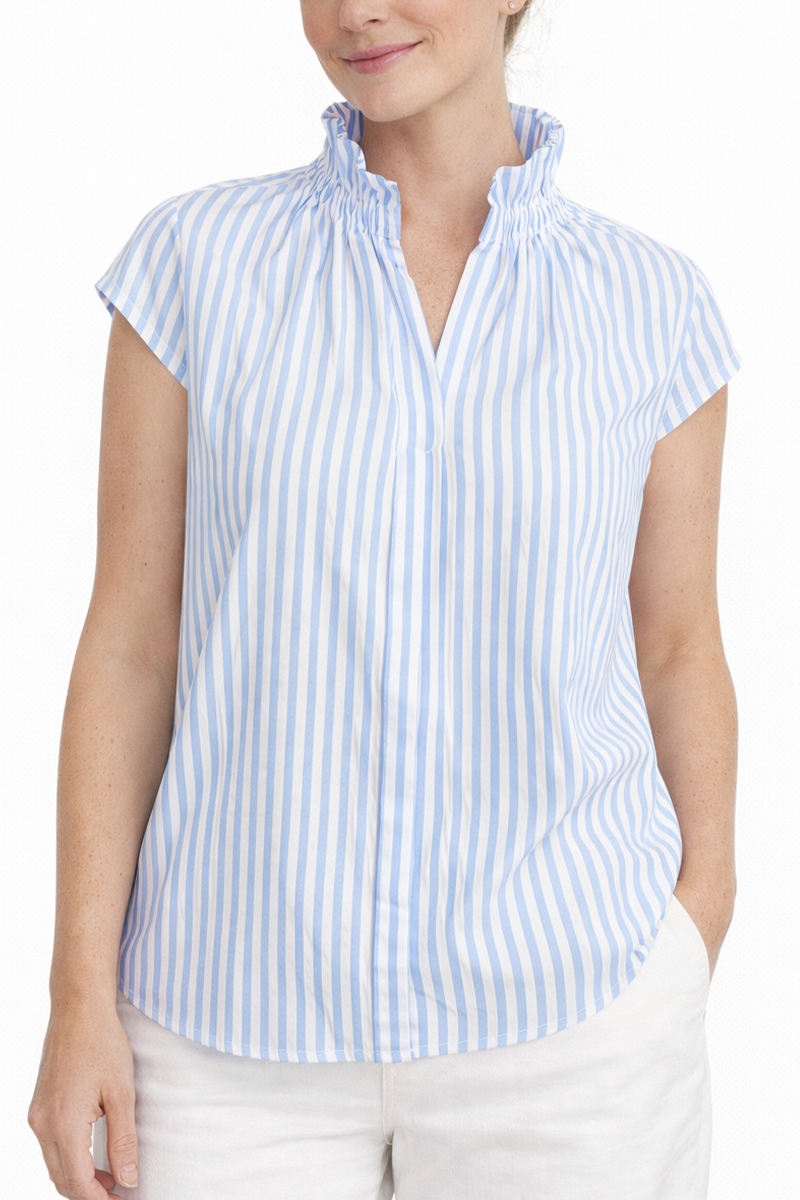 Woman wearing a blue and white striped shirt with a plain background