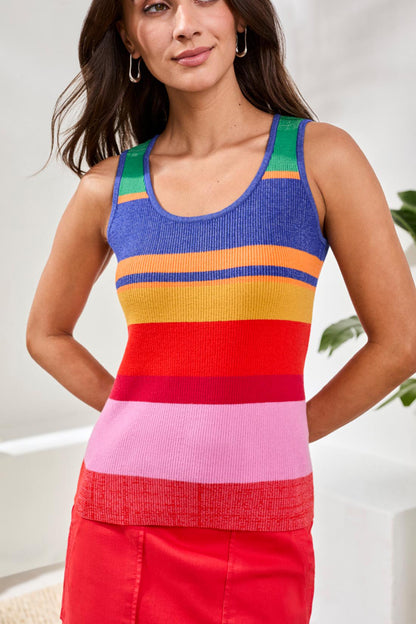 Woman wearing a colorful striped tank top with a white background