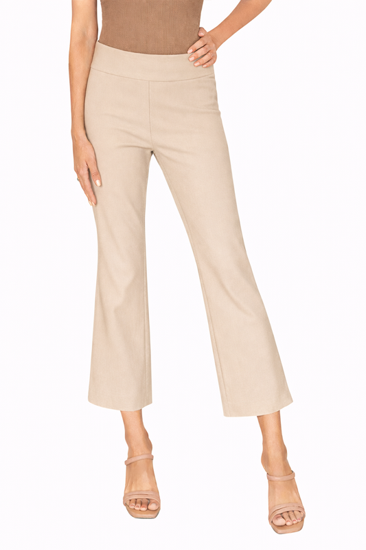 Beige pants worn by a person on a white background