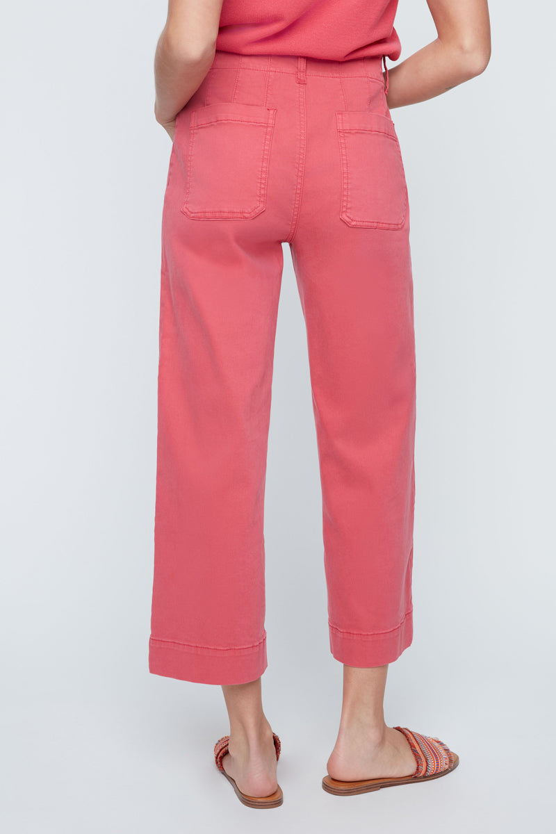 Person wearing pink pants on a white background