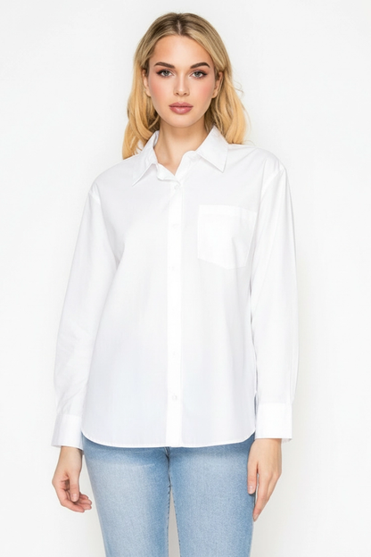 Woman wearing a white shirt and light blue jeans on a white background