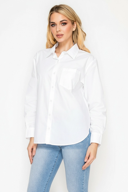 Woman wearing a white shirt and light blue jeans on a white background
