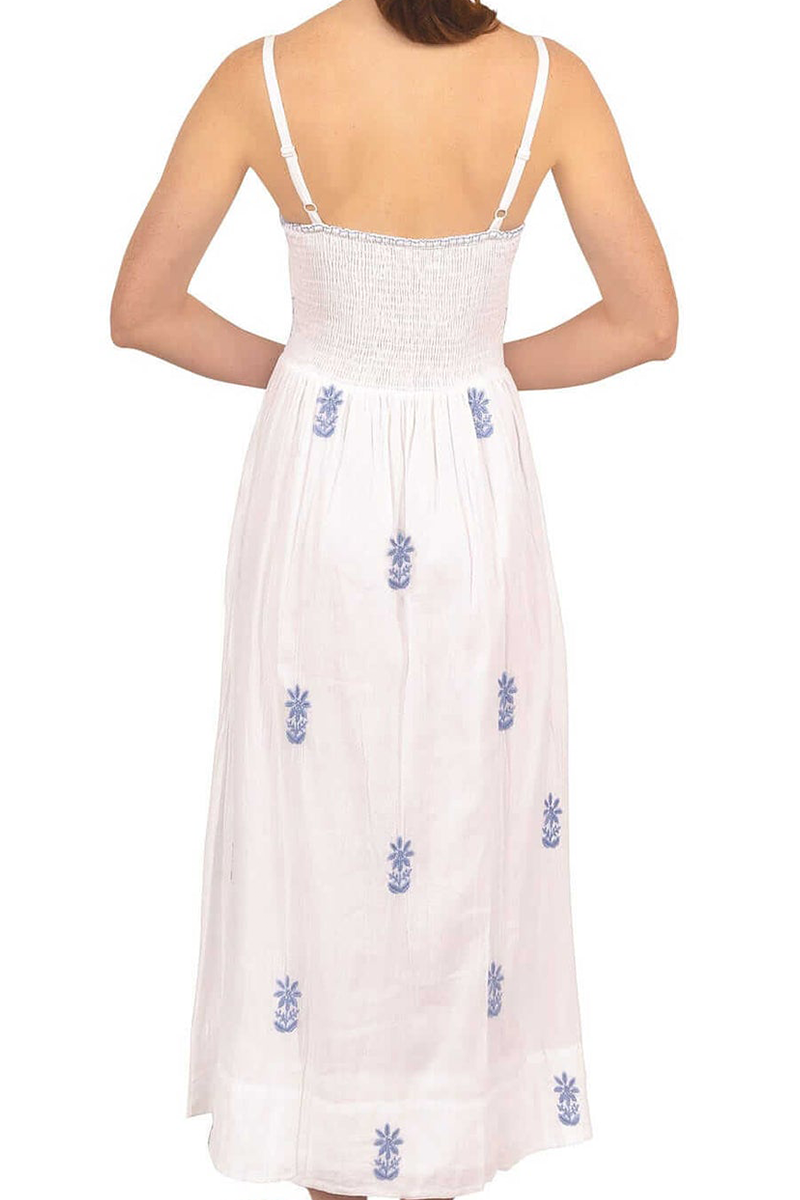 White dress with blue floral embroidery on a white background