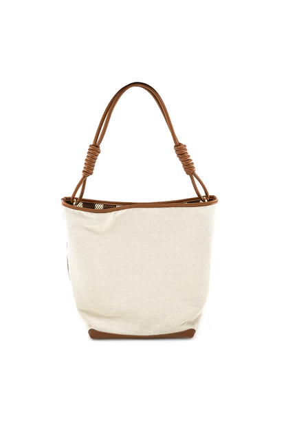 Beige tote bag with brown handle and trim on a white background