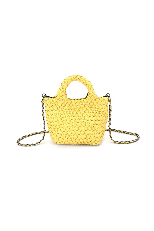 Yellow woven handbag with chain crossbody strap on a white background